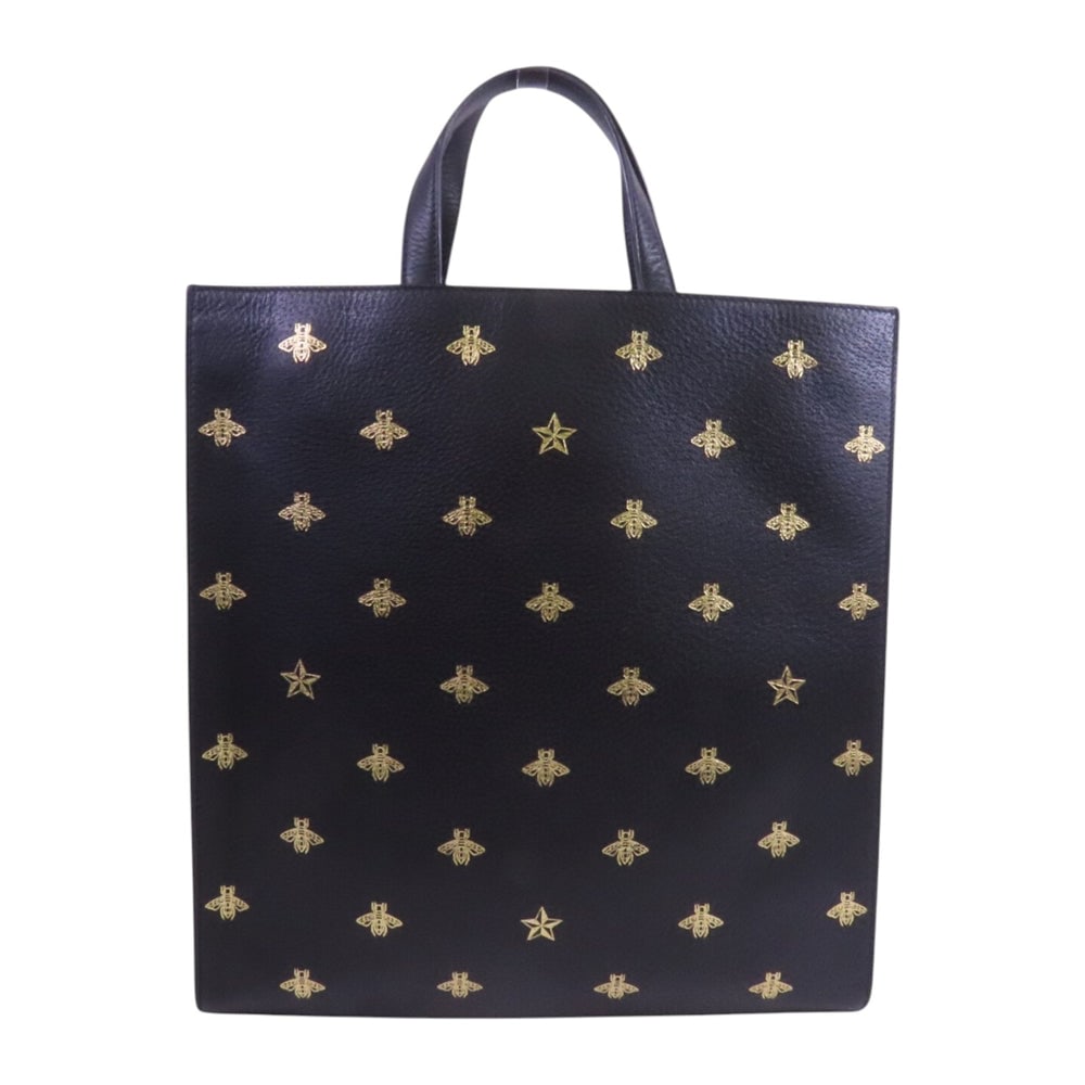 Gucci Bee Star Tote Handbag Black: Authentic and authenticated Gucci Bee Star tote handbag in black calfskin. Product no. 498075. Approx. 3535W x 37.3H x 7.2D cm with 28 cm handle. No accessories listed.