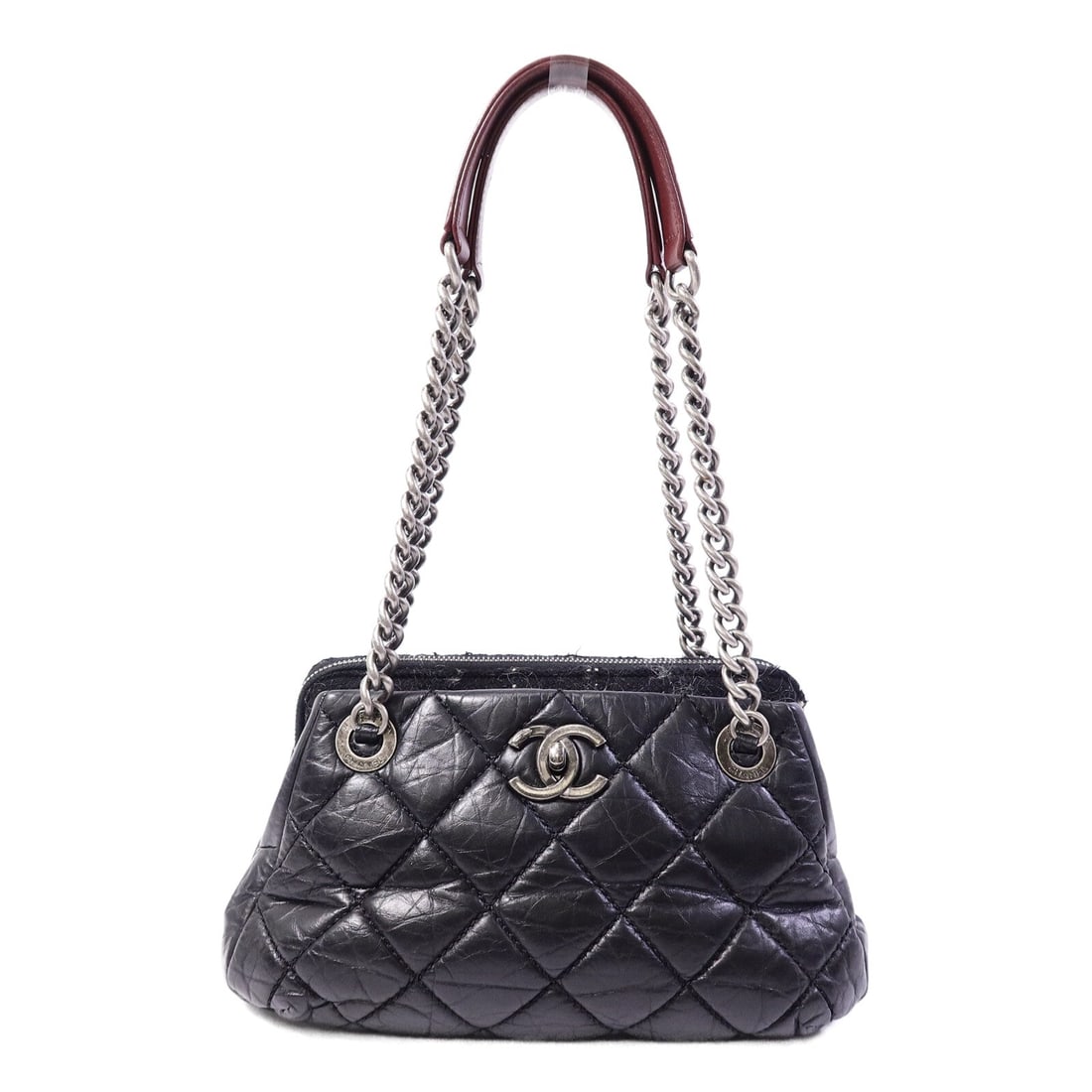 Chanel Chain Shoulder Bag Tweed: Black calfskin and tweed chain shoulder bag.
