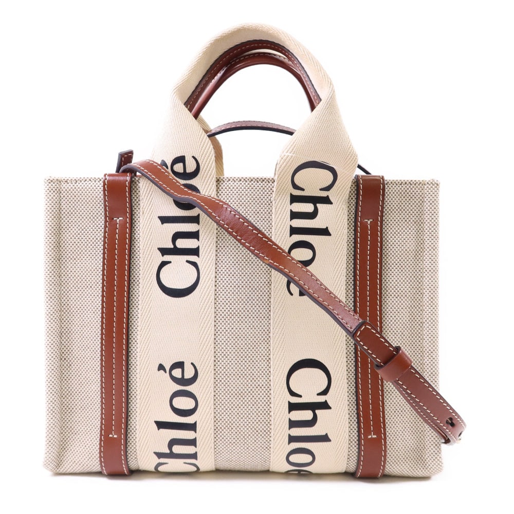 Chloe Woody Small 2 Way Bag: Authentic and authenticated Chloe Woody Small 2 Way shoulder bag in beige and brown canvas. Product no. 032210166. Approx. 26W x 20H x 8.5D cm with 26 cm handle and 110-117.5 cm strap.