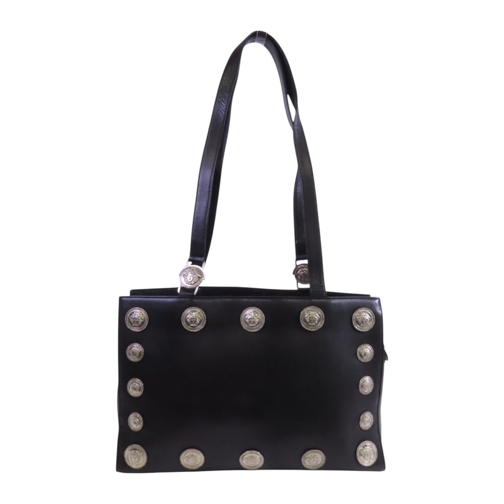 Versace Black Leather Tote Shoulder Bag: Authentic and authenticated Versace tote shoulder bag in black calfskin. Approx. 42W x 28H x 11.5D cm with 90 cm shoulder strap. No accessories listed.