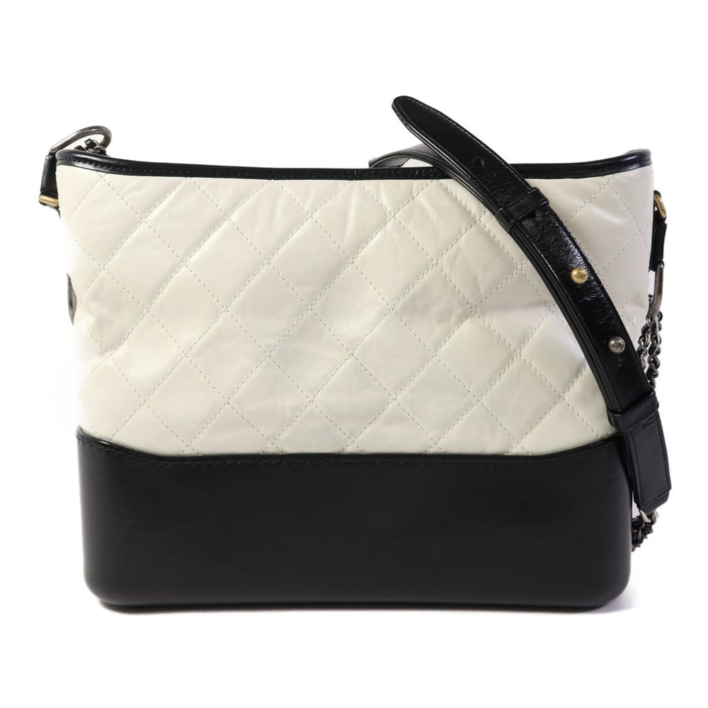 Chanel Gabrielle Medium Shoulder Bag: White and black calfskin Gabrielle medium shoulder bag with SHW; hologram sticker included; W27 x H20 x D9 cm; strap 89-142 cm. Authentic and authenticated.