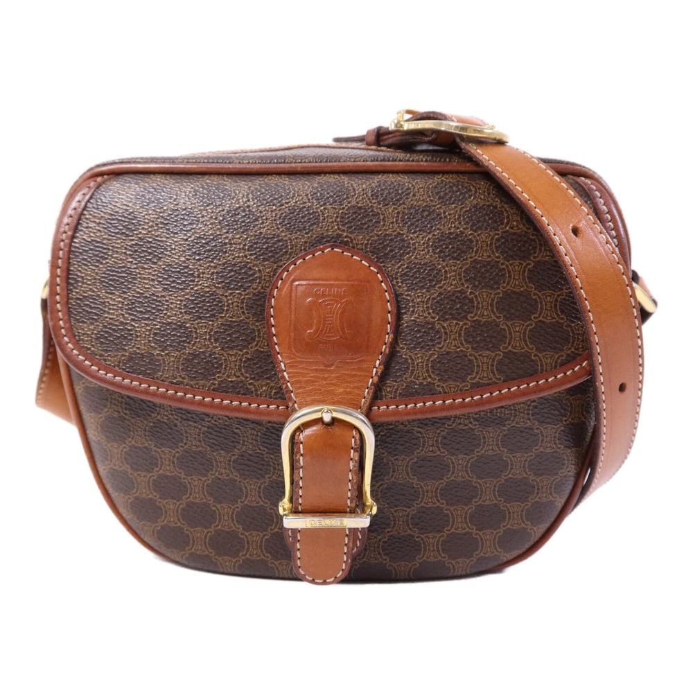Celine Vintage Madama Shoulder Bag: Authentic and authenticated Celine Vintage Madama shoulder bag in brown PVC coated canvas. Product no. M08. Approx. 18.5W x 14H x 7.5D cm with 108-118.5 cm strap. No accessories listed.