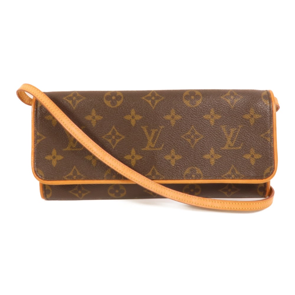 Louis Vuitton Twin GM Monogram: Pochette Twin GM shoulder bag in brown Monogram canvas. Includes storage bags. Size 24 x 12 x 2 cm.