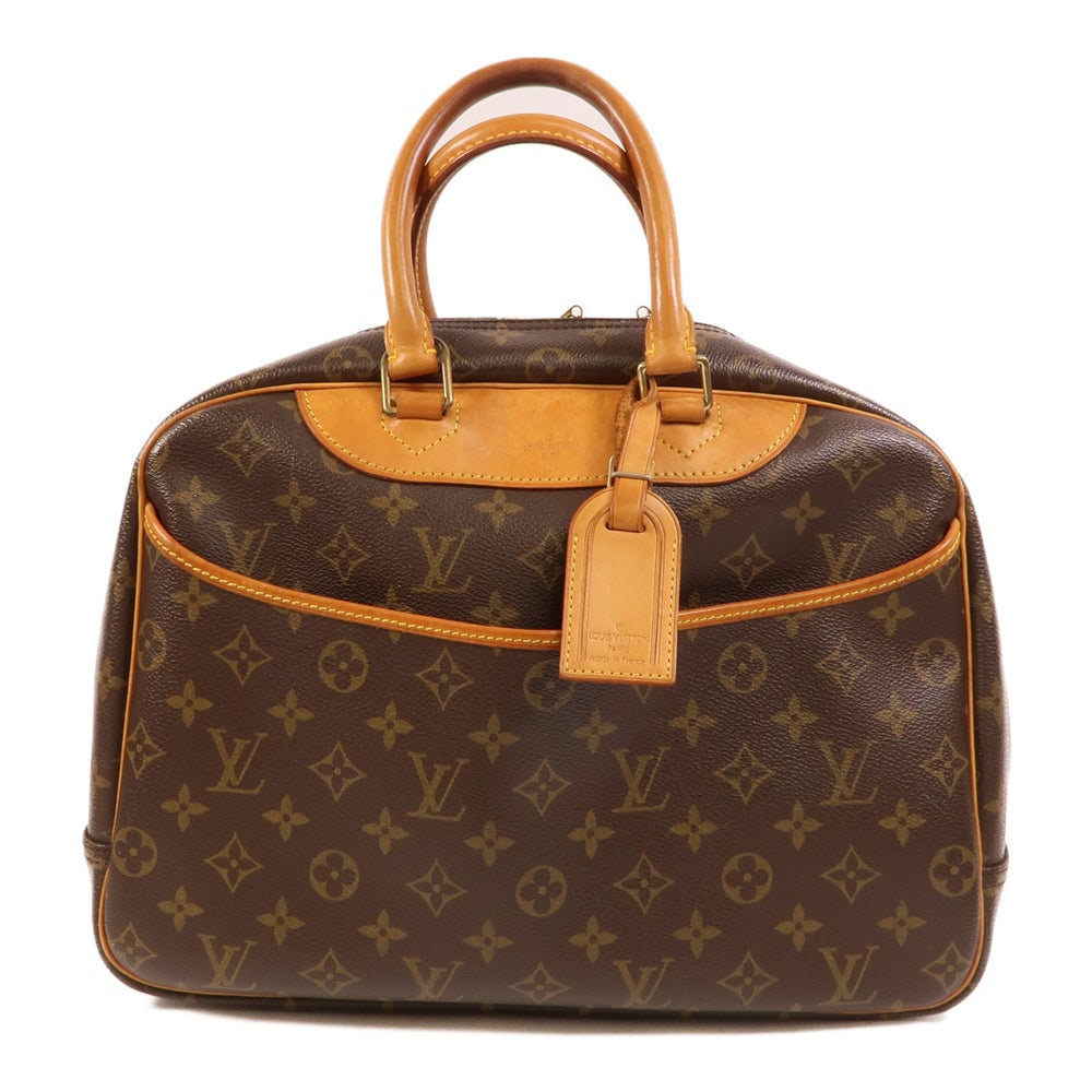 Louis Vuitton Deauville Monogram: Deauville handbag M47270 in brown Monogram canvas. Includes name tag. Size 34 x 25 x 13 cm.