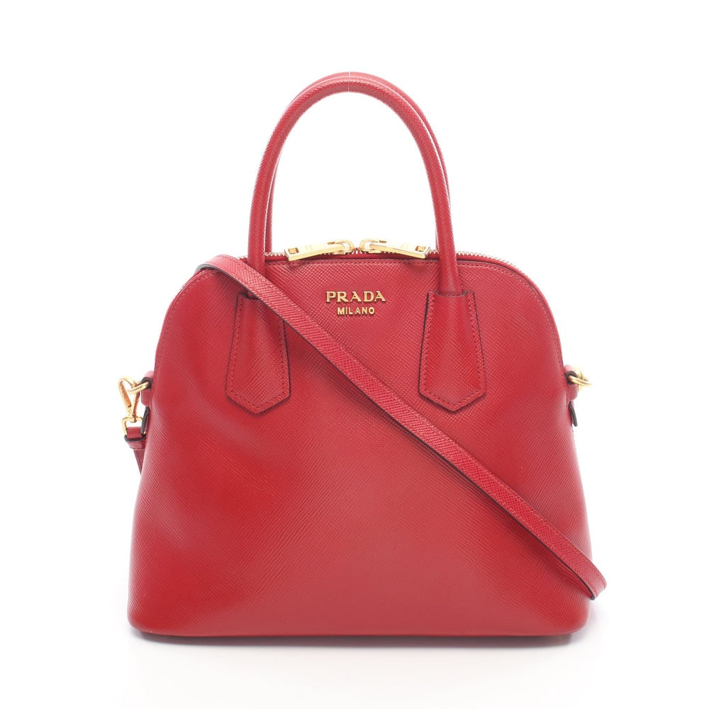 Prada Saffiano Cuir 2Way Handbag Red: Authenticated genuine Prada Saffiano Cuir 2WAY handbag in red saffiano leather, model BL0907. Includes shoulder strap and guarantee card. Approx. H23 x W25 top/28 base x D11 cm, strap 115-125 cm,