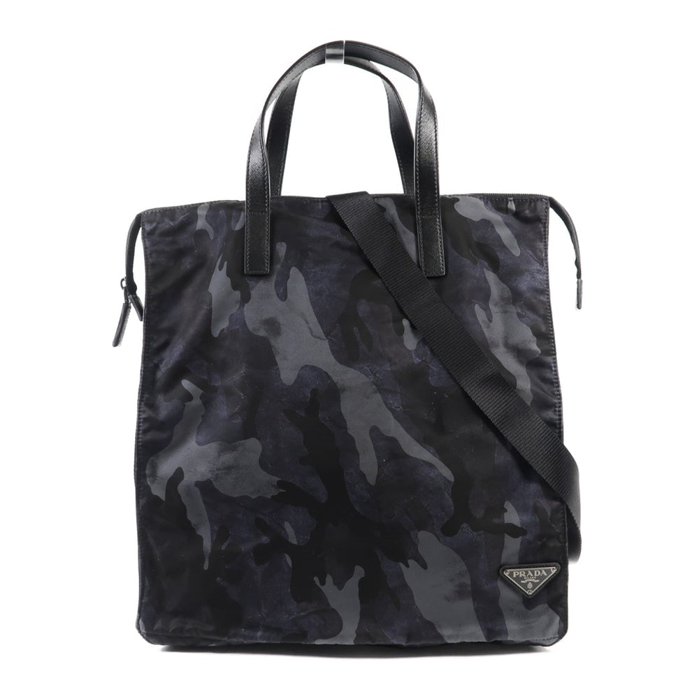 Prada Camouflage Nylon 2Way Bag: Authenticated genuine Prada 2-way shoulder bag in camouflage nylon, model VA1050. Includes storage bags and guarantee. Approx. W35 x H36.5 x D19 cm, handle 26.5 cm, shoulder 75-126 cm.