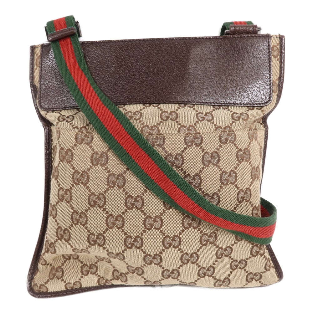 Gucci Gg Cross Carry Brown: Gucci Cross Carry Shoulder Bag. Color: Brown. Material: Gg Canvas. Size: 24 X 25 X 0.5 Cm. Shoulder: 75-145 Cm.