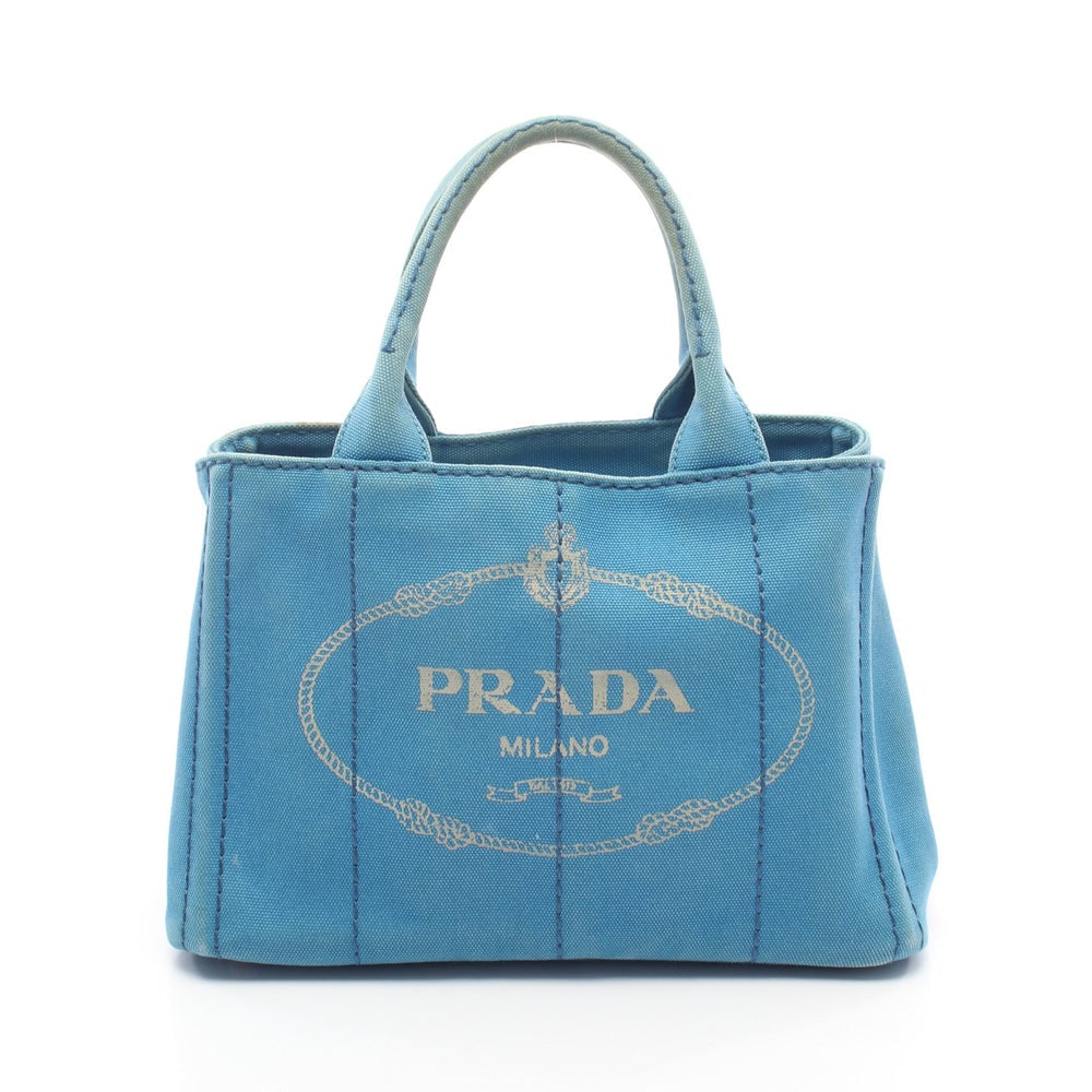 Prada Canapa 2Way Tote Blue: Prada Canapa Kanapa Handbag Tote Bag. Color: Blue. Material: Canvas. Size: 28/28.5 X 19 X 15 Cm. Handle: 28 Cm. Strap: 72-123 Cm. Includes: Shoulder Strap, Guarantee Card.