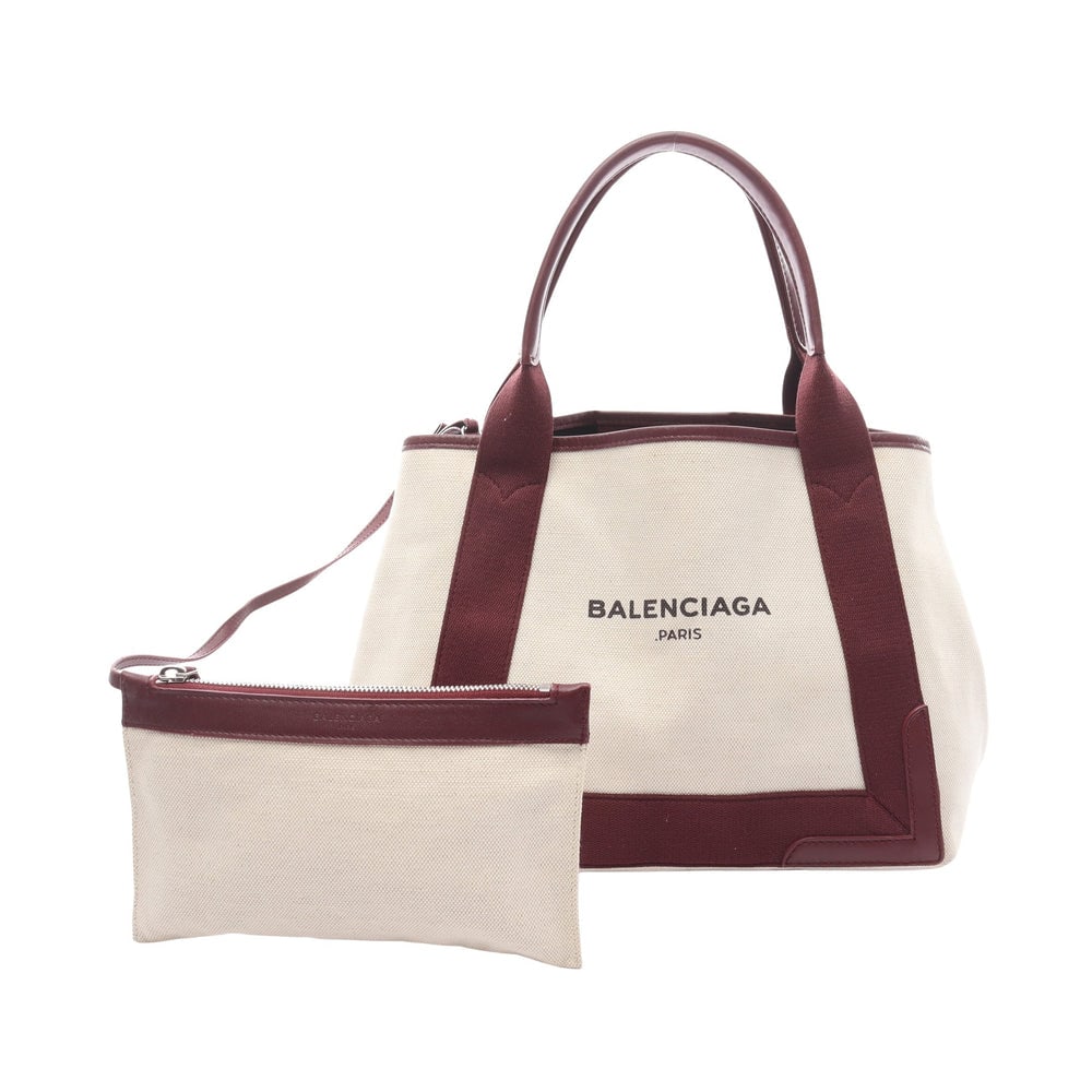 Balenciaga Navy Cabas S Bordeaux: Balenciaga Navy Cabas S Handbag Tote Bag. Color: Ivory Bordeaux. Material: Canvas Leather. Size: 32/30 X 22 X 18 Cm. Handle: 45 Cm. Includes: Pouch.