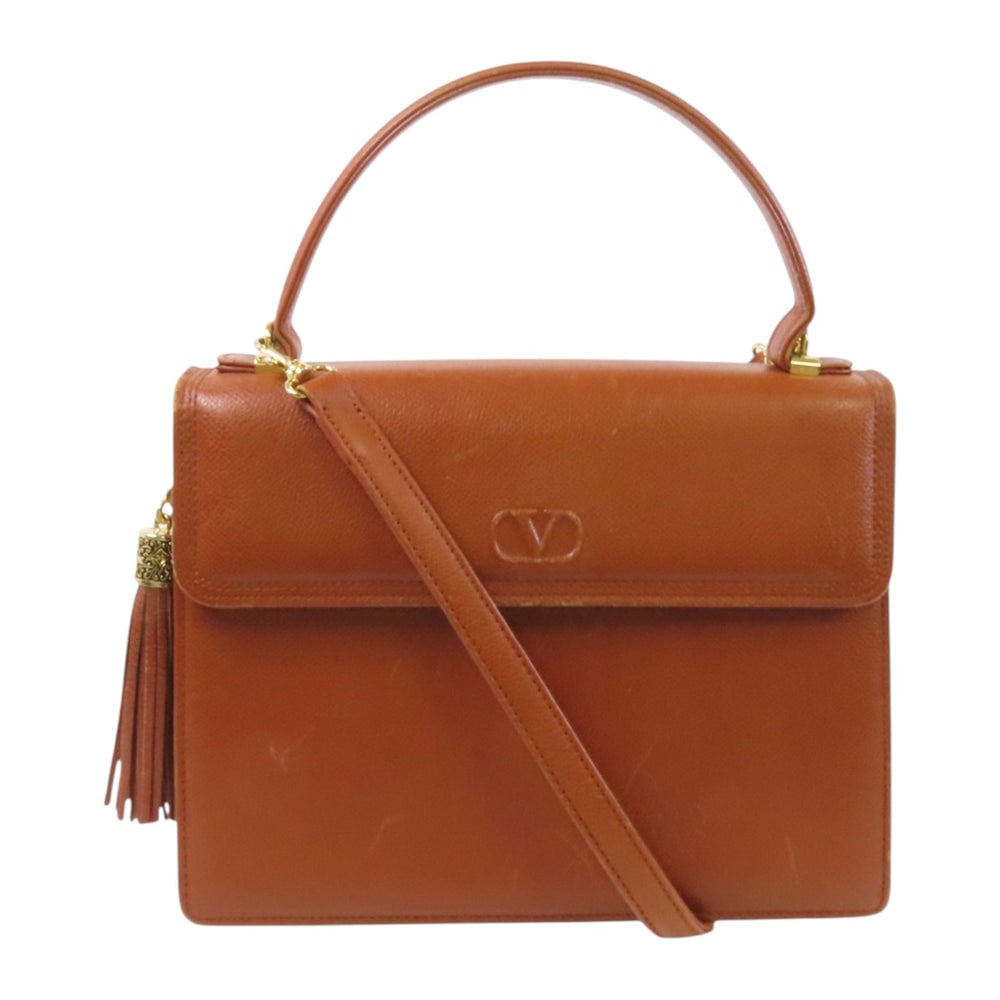 Valentino Brown Calfskin Shoulder Bag: Authentic and authenticated Valentino handbag shoulder bag in brown calfskin. Approx. 25W x 19.3H x 6.7D cm with 29 cm handle and 92-122 cm strap. Includes shoulder strap.