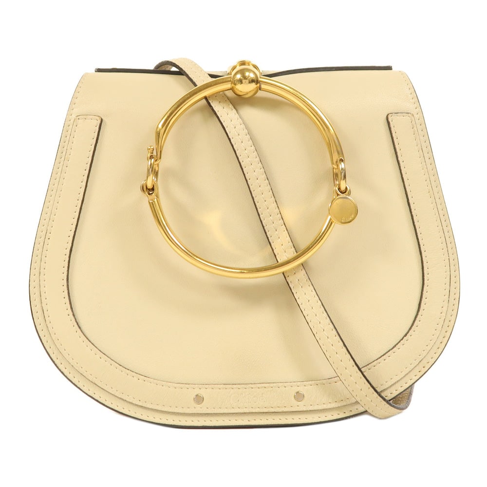 Chloe Nile Ivory Shoulder Bag: Authentic and authenticated Chloe Nile shoulder bag in ivory calfskin. Approx. 23.5W x 20.5H x 9D cm with 102-120 cm shoulder strap. Includes shoulder strap.