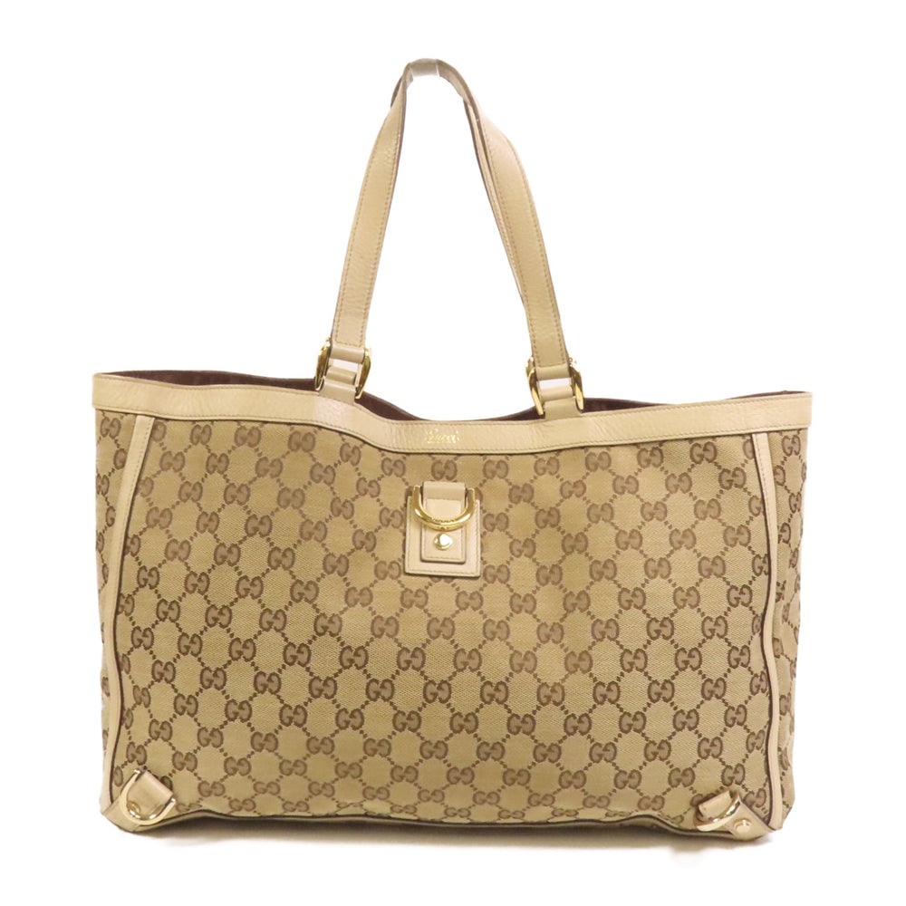 Gucci Abbey GG Canvas Tote Bag: Authentic and authenticated Gucci Abbey tote bag in brown beige GG canvas. Product no. 001364. Approx. 38W x 26H x 11D cm with 41 cm handle. Includes storage bags.