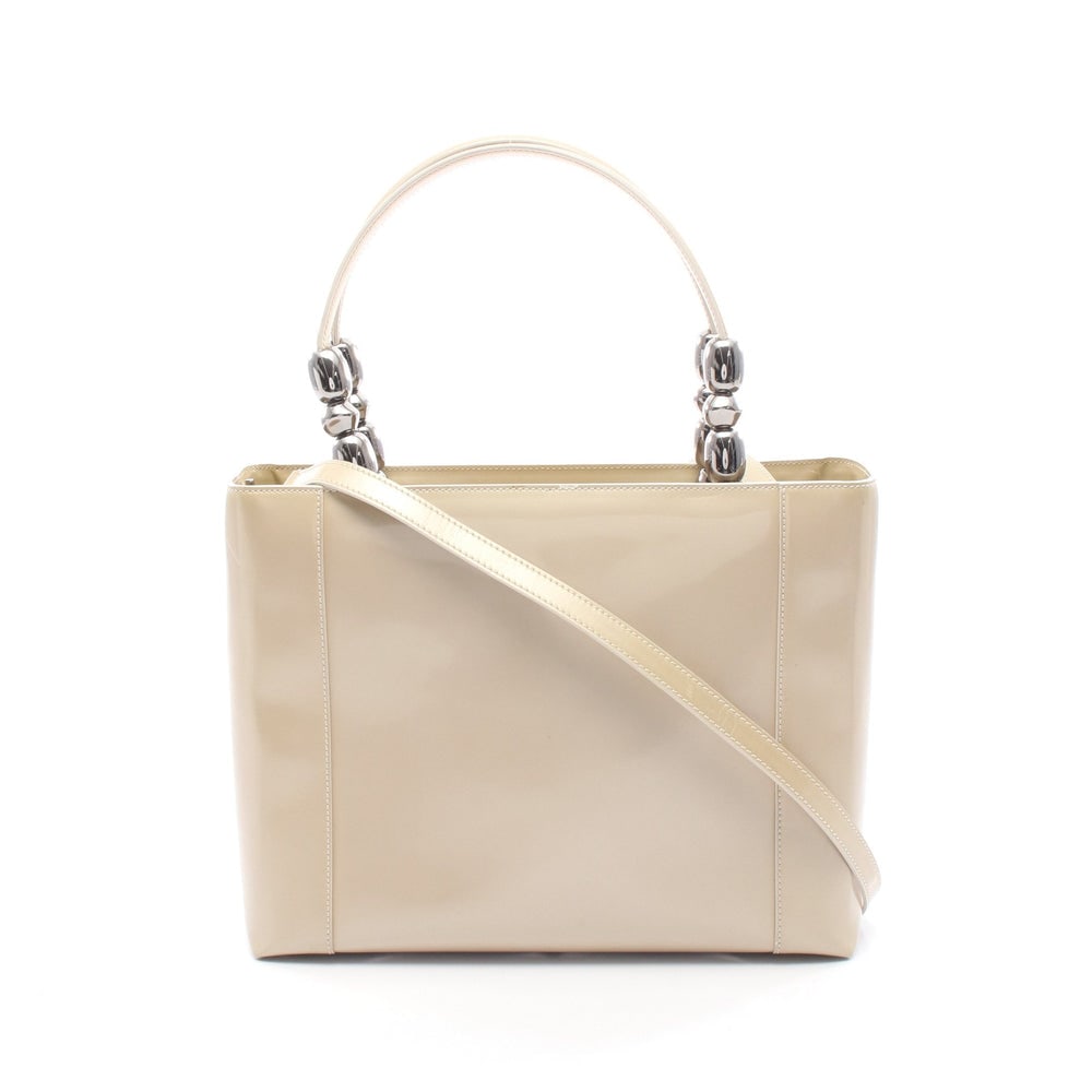 Dior Maris Pearl Patent 2WAY Bag: Authentic and authenticated Christian Dior Maris Pearl 2WAY handbag in beige patent leather. Approx. 23H x 30/29W x 10D cm with 43 cm handle and 98 cm strap. Includes shoulder strap.