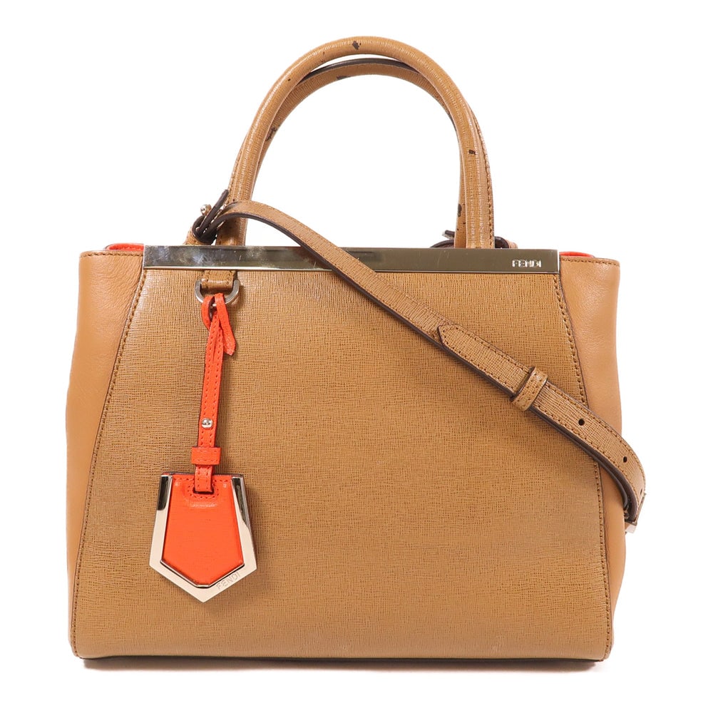 Fendi 2 Way Shoulder Handbag Brown: Authentic and authenticated Fendi 2 way shoulder handbag in brown and red calfskin. Product no. 148.2461. Approx. 26W x 20.5H x 9.5D cm with 30 cm handle and 113-122 cm strap. Includes storage bags.