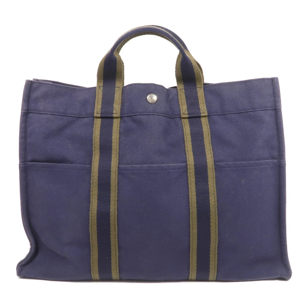 Hermes Herline MM Tote Navy: Authentic and authenticated Hermes Herline MM tote bag in navy canvas. Approx. 42W x 31H x 10D cm with 27 cm handle. No accessories listed.
