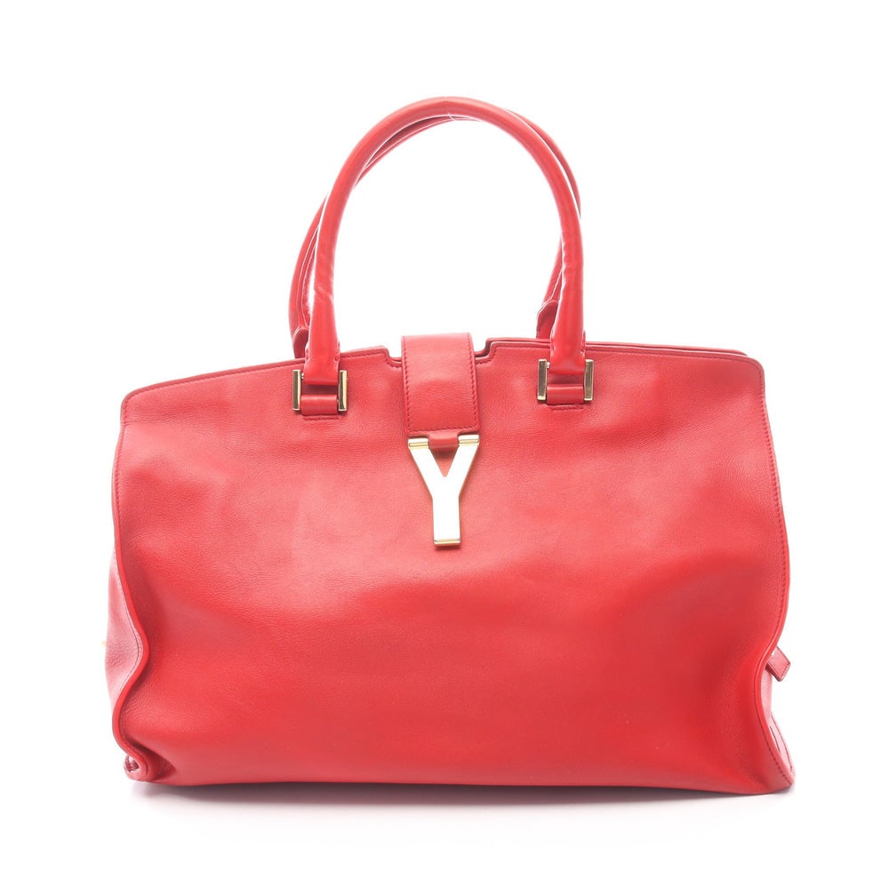 Saint Laurent Y Line Kabas Red: Authentic and authenticated Saint Laurent Paris Y line Kabas handbag in red leather. Approx. 23H x 35.5/36W x 18D cm with 40 cm handle.