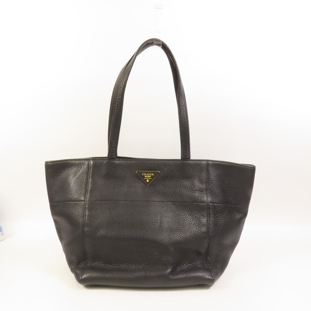 Prada Black Calfskin Tote Bag: Authentic and authenticated Prada tote shoulder bag in black calfskin. Approx. 24-42W x 24H x 20D cm with 52 cm shoulder handle. Includes guarantee.