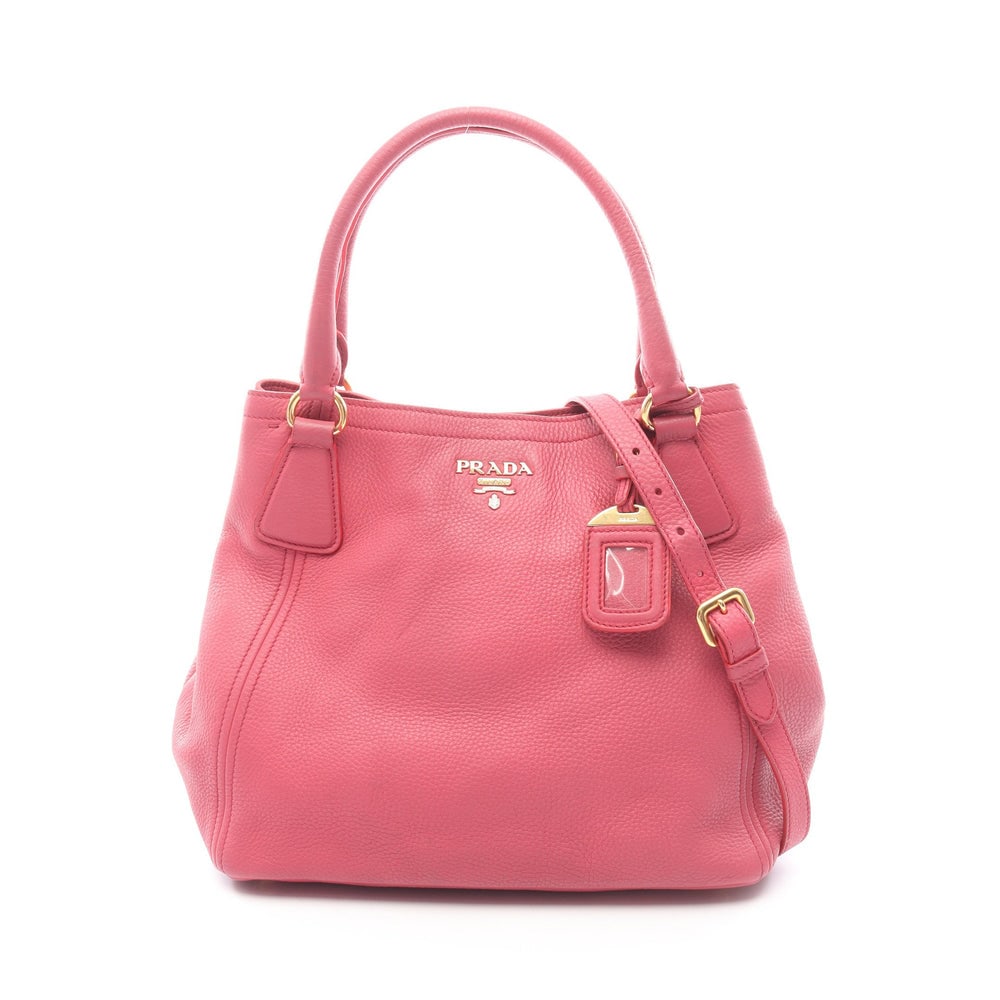 Prada Vit Daino 2WAY Handbag: Authentic and authenticated Prada VIT DAINO 2WAY handbag in pink purple leather. Approx. 26H x 28/30.5W x 18D cm with 45 cm handle and 103-113 cm strap. Includes shoulder strap and name tag.
