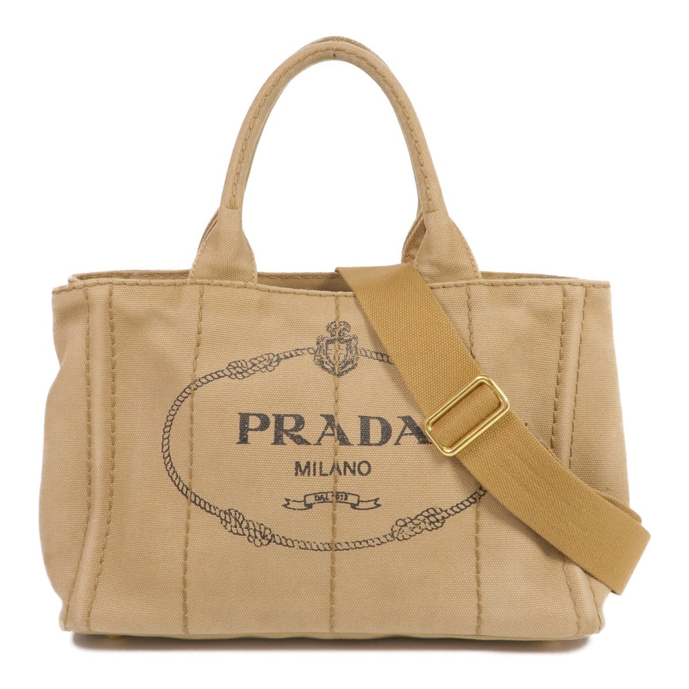 Prada Canapa Brown 2Way Tote: Authenticated genuine Prada Canapa tote bag 2-way shoulder bag in brown canvas with gold-tone hardware. Includes shoulder strap. Approx. W28 x H18 x D14 cm, handle 32 cm.