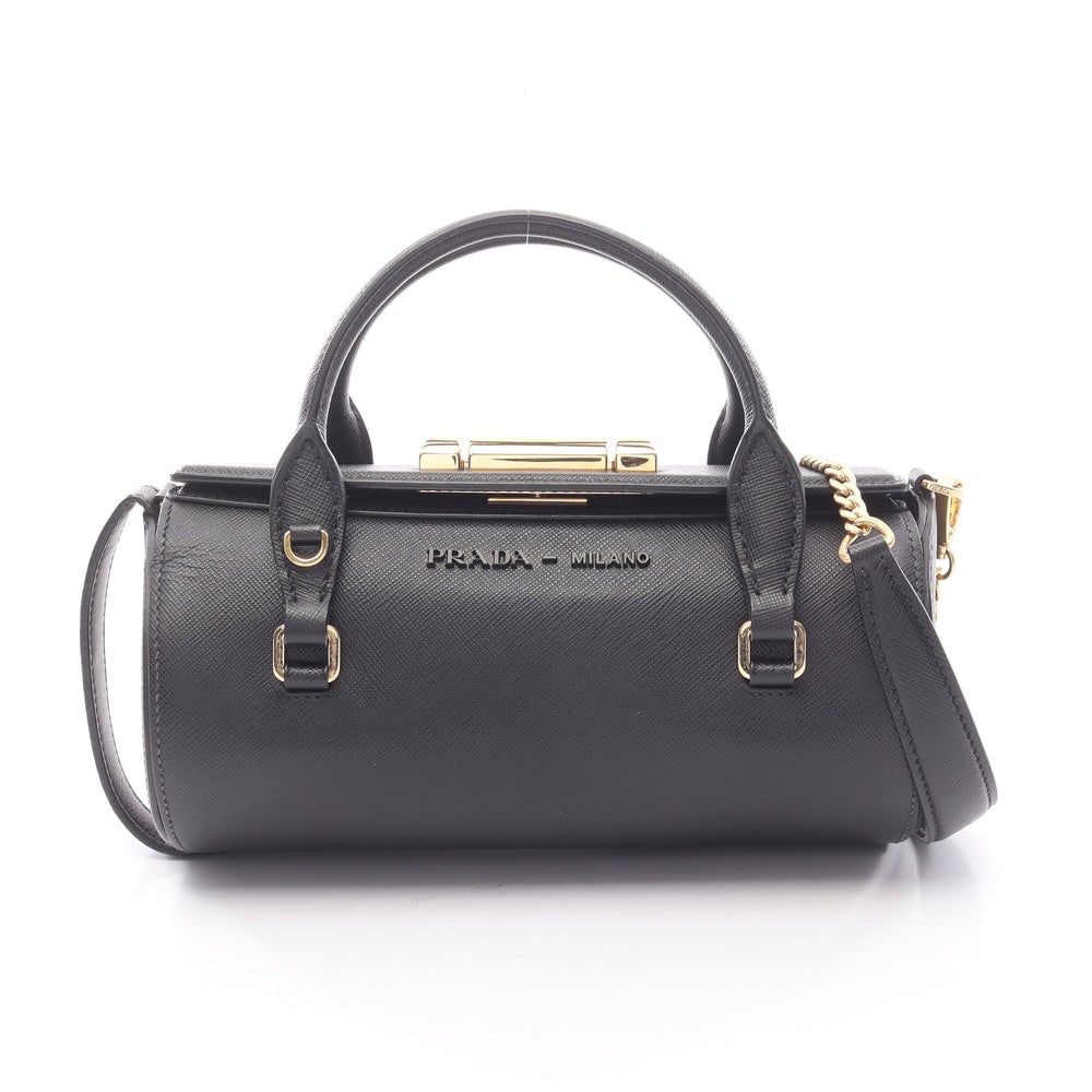 Prada Saffiano 2-Way Handbag Black: Black Saffiano leather Prada 2-way handbag with shoulder strap. Approx. 22 x 10.5 x 5 cm; handle 34 cm; strap 123 cm. Authentic and authenticated.