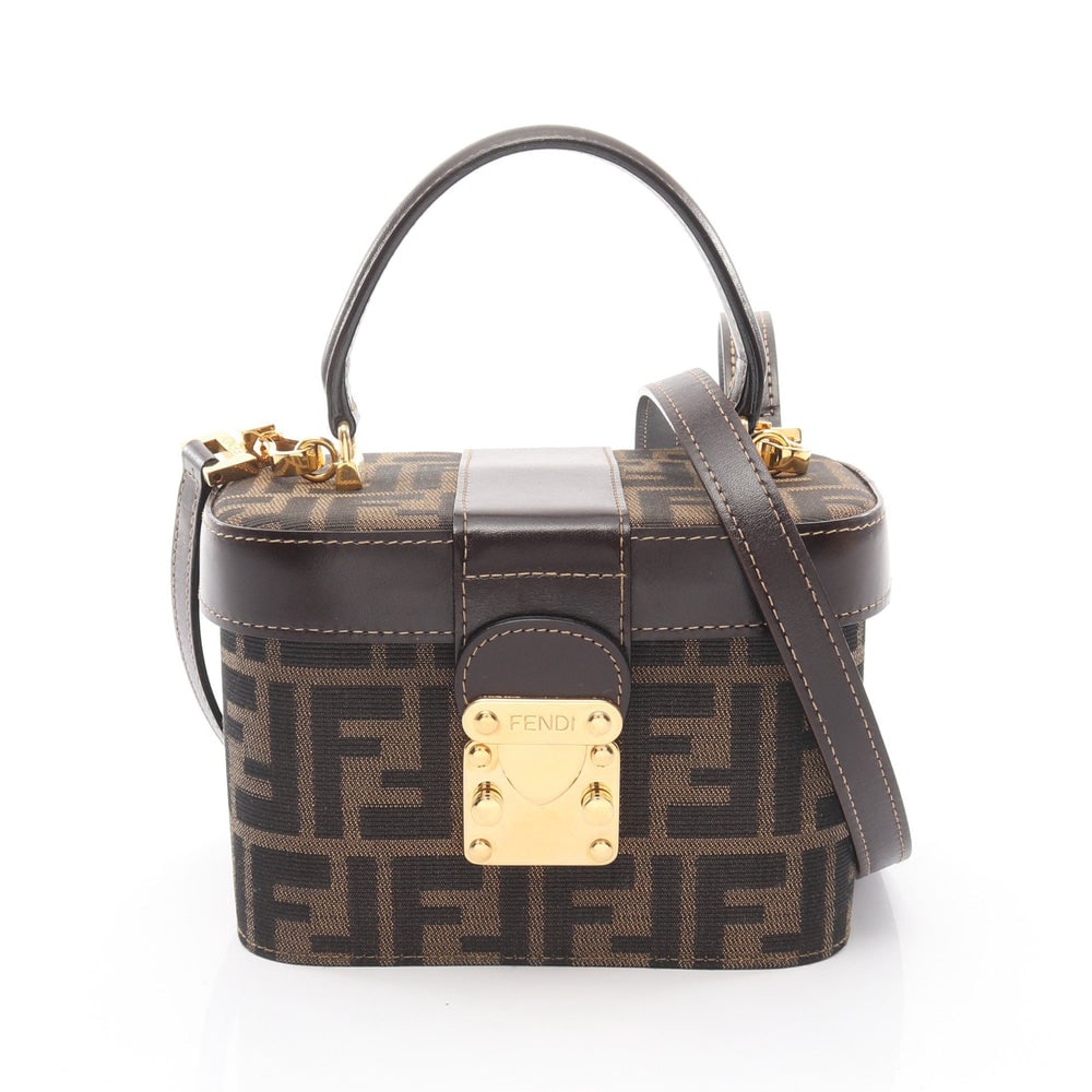 Fendi Zucca Vanity 2-Way Brown: Brown and dark brown canvas and leather Fendi Zucca vanity 2-way handbag with shoulder strap. Approx. 18 x 12 x 10 cm; handle 23 cm; strap 125 cm. Authentic and authenticated.