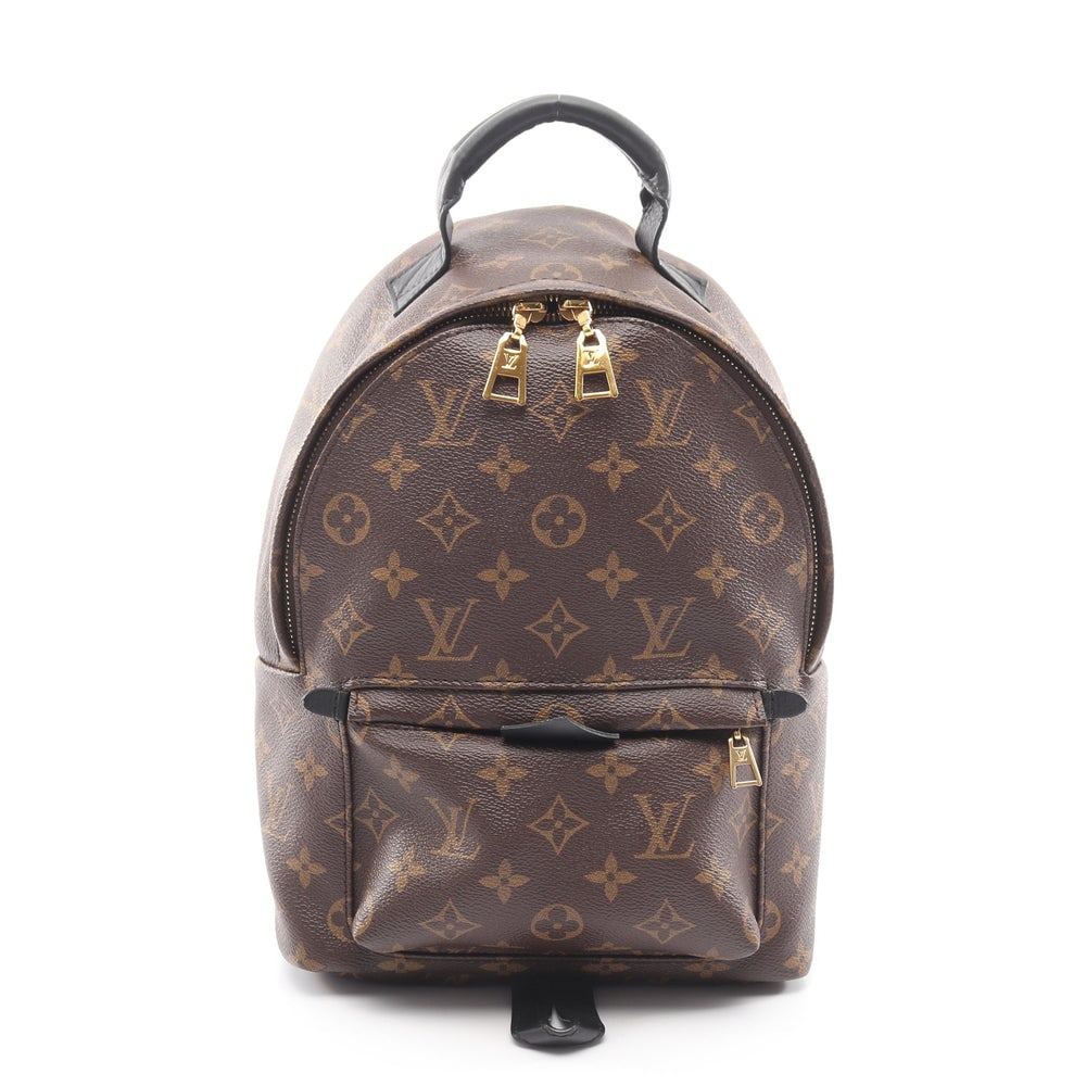 LV Palm Springs PM Brown Black: Brown and black Monogram PVC leather Palm Springs PM backpack. Approx. 21 x 29 x 9 cm; strap 55-82 cm; handle 17 cm. Model M41560, product no. FL2148. Authentic and authenticated.