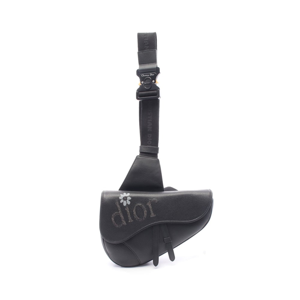 Dior x ERL Saddle Body Bag Black: Black leather Dior x ERL Saddle body bag. Approx. 27 x 17 x 4 cm; max strap 94 cm. Model 1ADPO093. Authentic and authenticated.