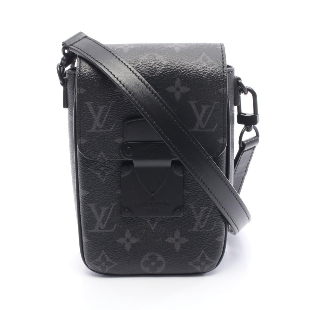 LV S-Lock Vertical Wallet Eclipse: Black Monogram Eclipse PVC leather S-lock Vertical Wearables Wallet shoulder bag. Approx. 12 x 18 x 1.5/4 cm; long strap 110-134 cm. Model M82252, RFID. Authentic and authenticated.