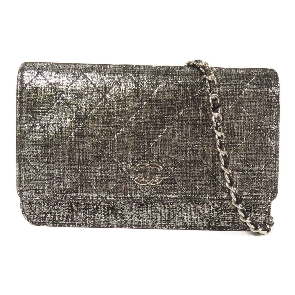 Chanel WOC Canvas Black Silver: Black and silver canvas Chanel WOC Wallet On Chain shoulder bag with hologram sticker. Approx. 19 x 12.5 x 4 cm; strap 124 cm. Product no. #19061955. Authentic and authenticated.