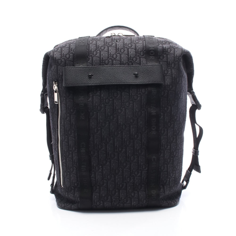 Dior Safari Oblique Backpack Black: Black canvas and leather Dior Safari Oblique backpack. Approx. 29 x 39 x 15 cm; max strap 85 cm. Authentic and authenticated.