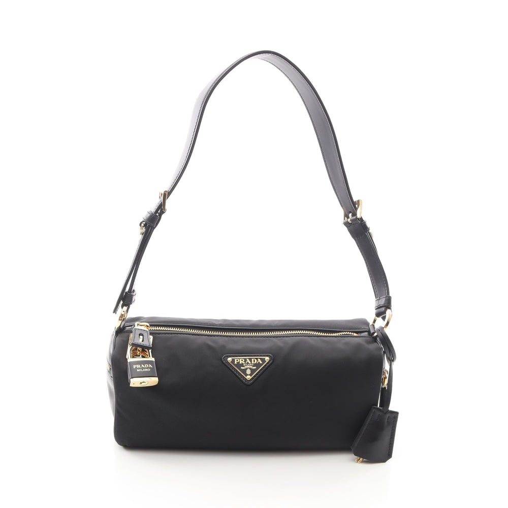 Prada Tessuto Vitello Black: Black nylon and leather shoulder bag. Includes storage bag keys crochet and padlock. 28 x 12 x 11 cm.