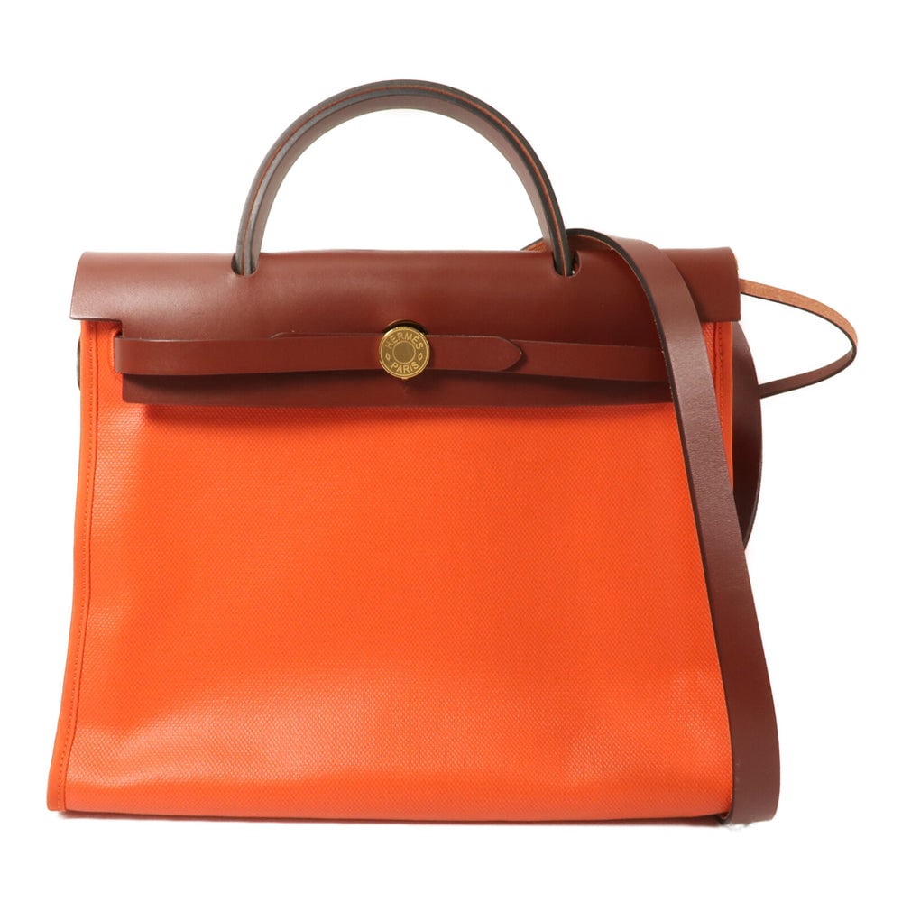 Hermes Herbag PM Orange Mecano: Orange canvas 2 way shoulder bag.