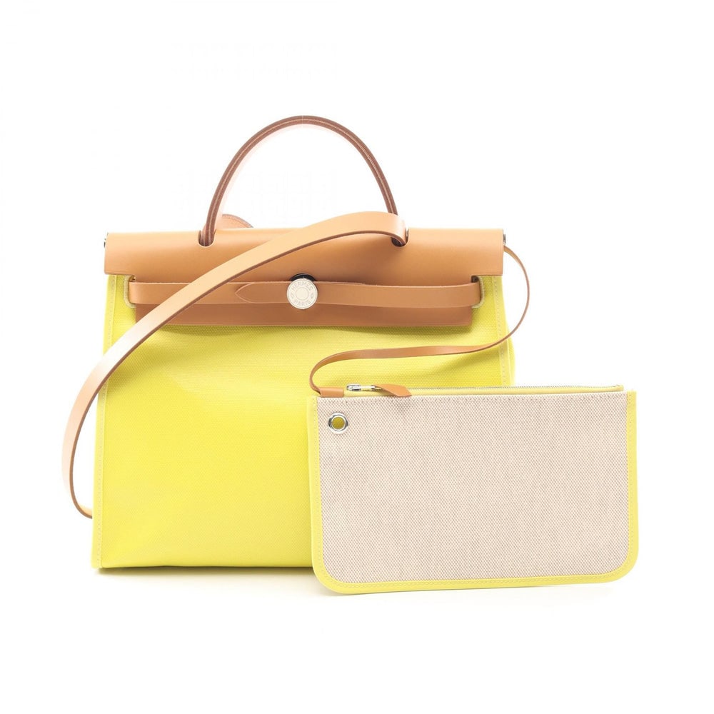 Hermes Herbag Zip PM Lime: Yellow and light brown Toile Twill Ash Berlin and Vache Hunter 2 way handbag; includes shoulder strap, pouch, and stopper. Authentic and authenticated.