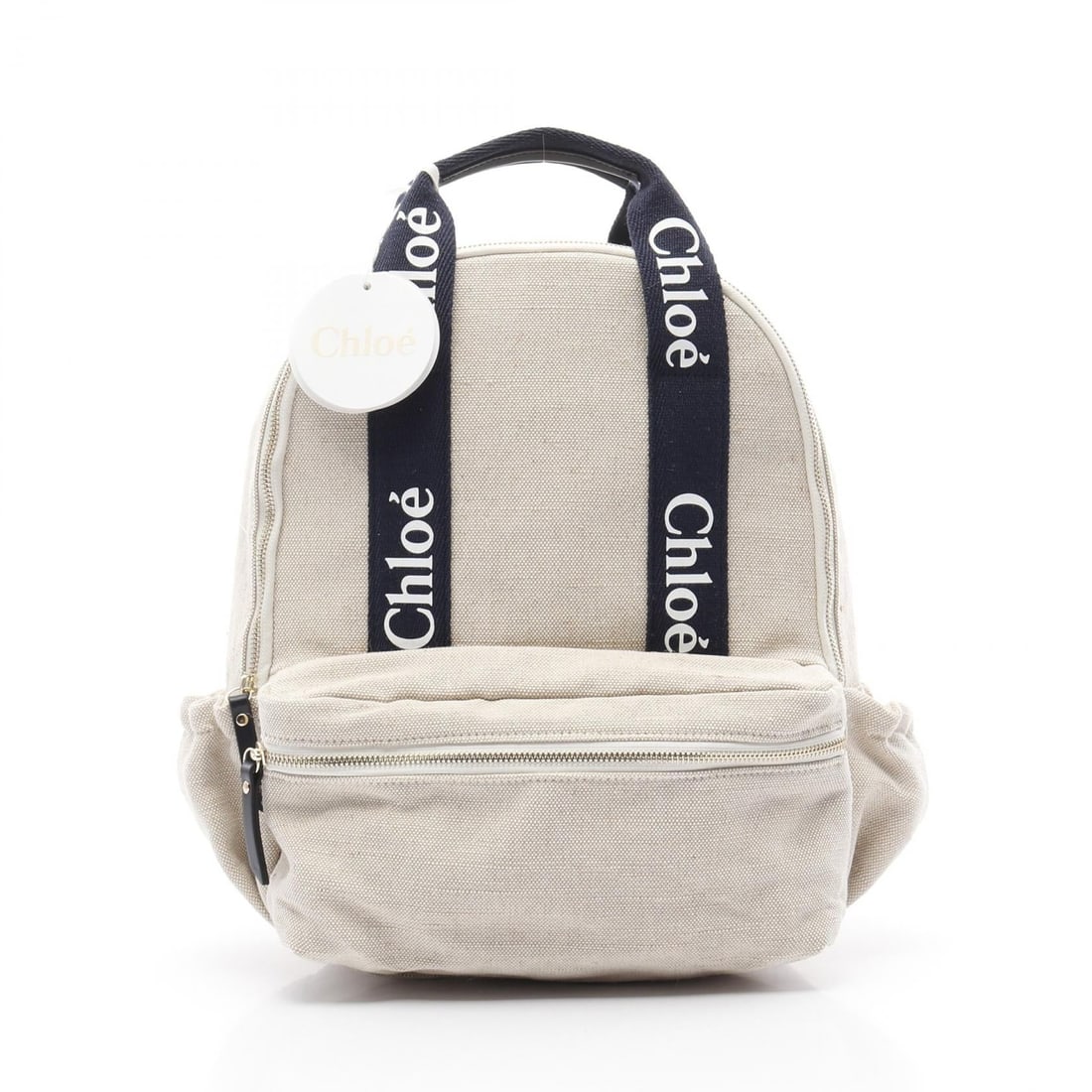 Chloe Kids Canvas Backpack Beige Navy: Authentic and authenticated Chloe Kids backpack in beige/navy canvas. Approx. 36.5H x 36W x 12.5D cm with 44 cm strap and 84 cm max strap. Size noted as -. No accessories listed.
