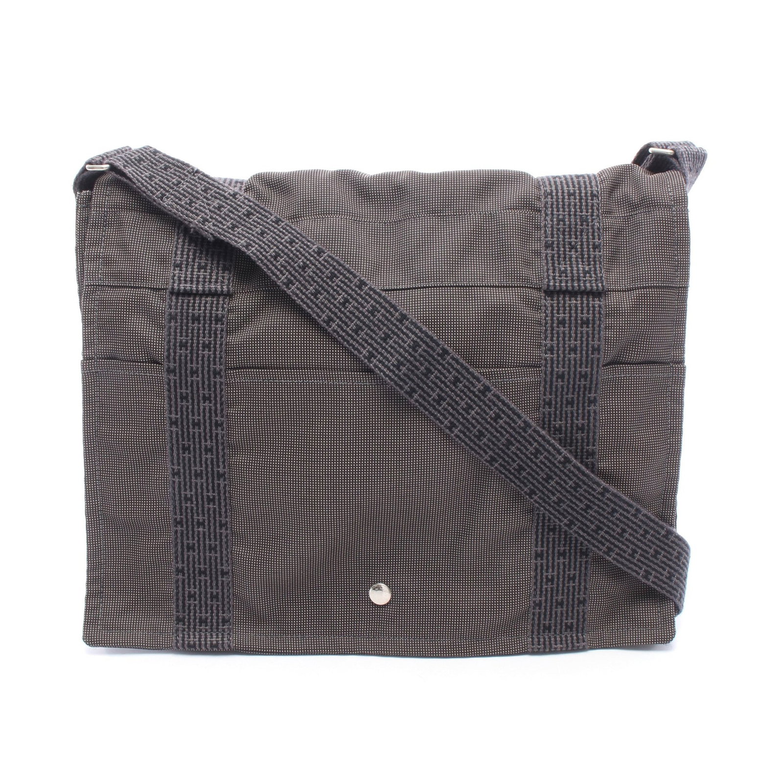 Hermes Yell Line Bass MM Shoulder Bag: Authentic and authenticated Hermes Yell Line Bass MM shoulder bag in gray canvas with silver hardware. Approx. 32H x 40W x 8D cm with 75-130 cm strap. No accessories listed.