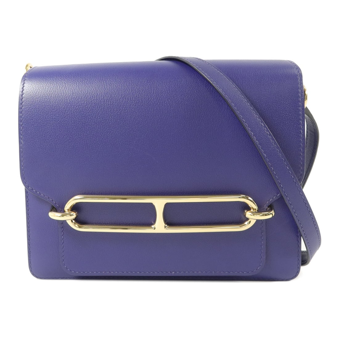 Hermes Roulis 23 Shoulder Bag Iris: Authentic and authenticated Hermes Roulis 23 shoulder bag in Iris Evercolor calfskin. Product no. DNN002DND. Approx. 23W x 21H x 7.5D cm with 90 cm strap. Includes storage bags.