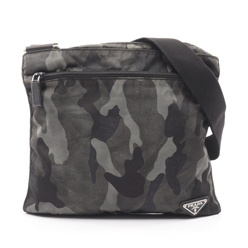 Prada Camouflage Nylon Shoulder Bag: Authentic and authenticated Prada camouflage shoulder bag in dark green multicolor nylon with Prada logo plate. Approx. 27.5H x 28/28.5W x 1D cm with 69-122 cm strap.