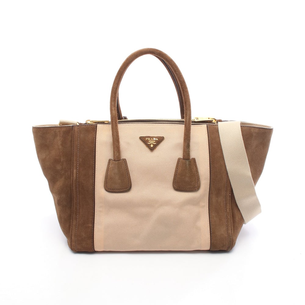 Prada Canapa Scamosciata 2WAY Bag: Authentic and authenticated Prada CANAPA+SCAMOSCIA 2WAY handbag in beige and brown canvas suede. Model BN2644. Approx. 25H x 50/31W x 20D cm with 42 cm handle and 69-121 cm strap. Includes shoulder