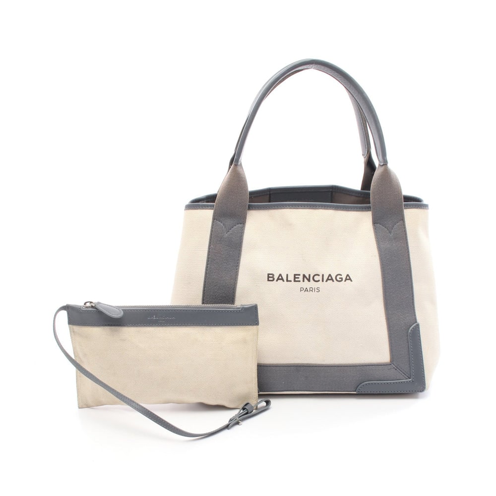 Balenciaga Navy Cabas S Gray: Balenciaga Navy Cabas S Handbag Tote Bag. Color: Ivory Gray. Material: Canvas Leather. Size: 32/30 X 22 X 18 Cm. Handle: 45 Cm. Includes: Pouch.
