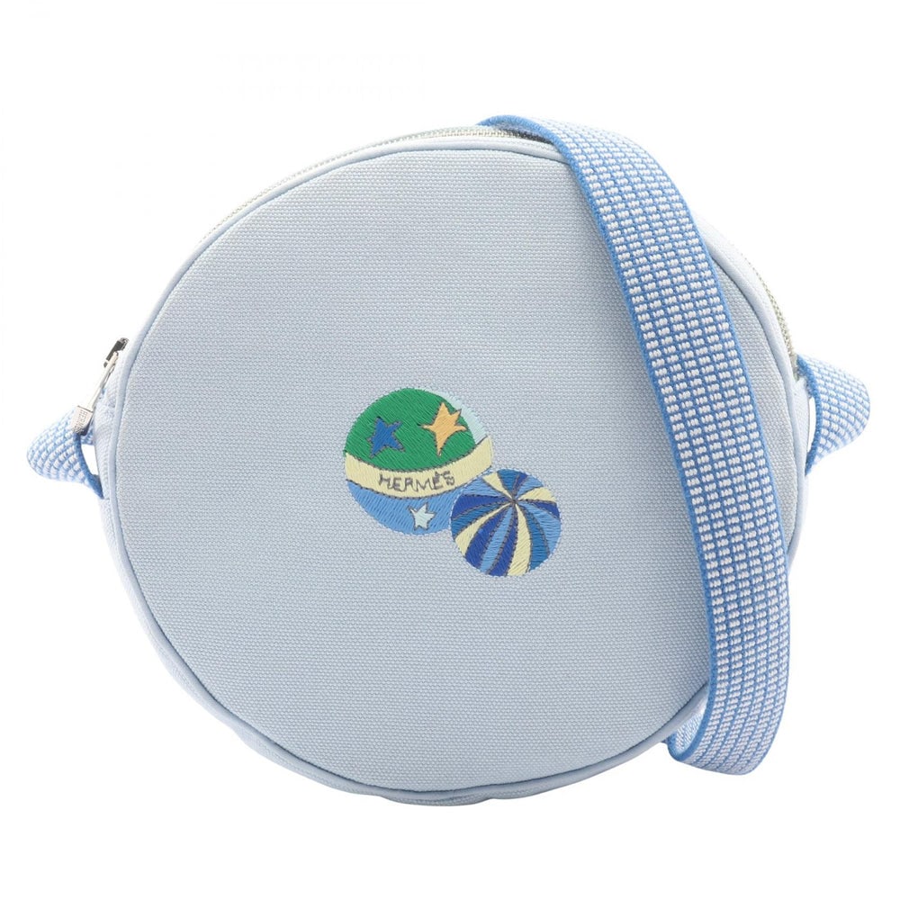 Hermes Circus Shoulder Bag Light Blue: Light blue canvas shoulder bag with silver hardware. 17 x 17 x 4 cm.