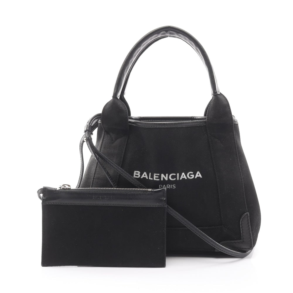 Balenciaga Navy Xs 2Way Black: Balenciaga Navy Hippopotamus Xs Handbag 2Way. Color: Black. Material: Canvas Leather. Size: 23/25 X 20 X 7 Cm. Handle: 37 Cm. Strap: 107-112 Cm. Includes: Pouch.