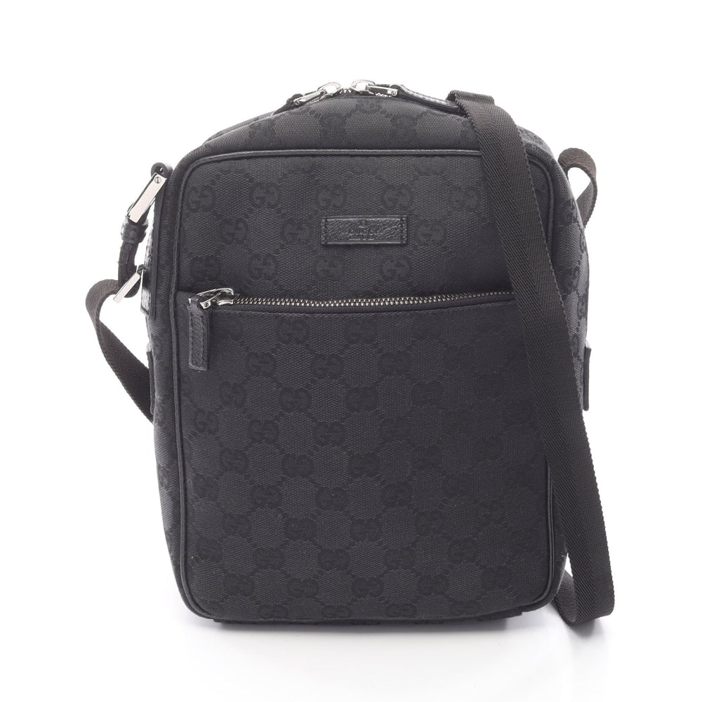Gucci GG Canvas Shoulder Bag Black: Authentic and authenticated Gucci GG canvas shoulder bag in black canvas and leather. Model 03136. Approx. 22.5H x 18W x 8D cm with 71-137 cm strap. No accessories listed.