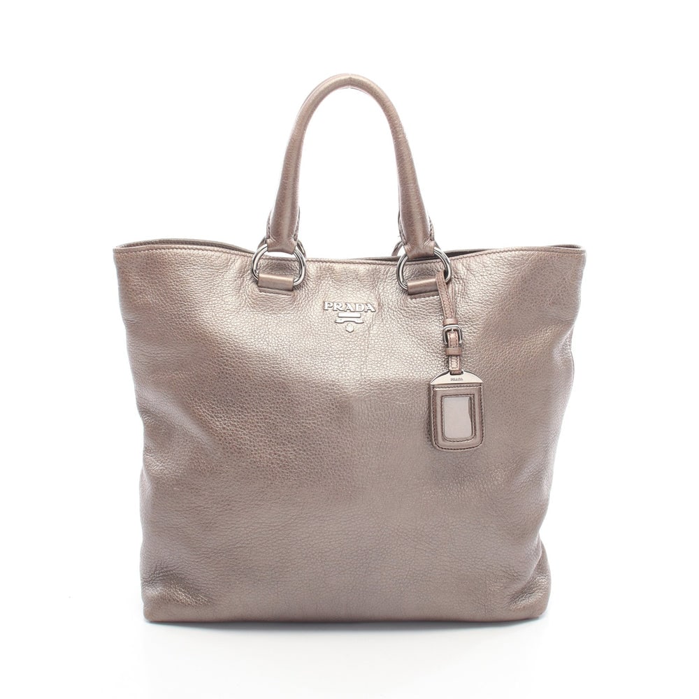 Prada Metallic Tote Gray Brown: Prada Handbag Tote Bag. Color: Gray Brown. Material: Leather. Size: 43/35 X 34 X 12 Cm. Handle: 37 Cm. Includes: Name Tag.