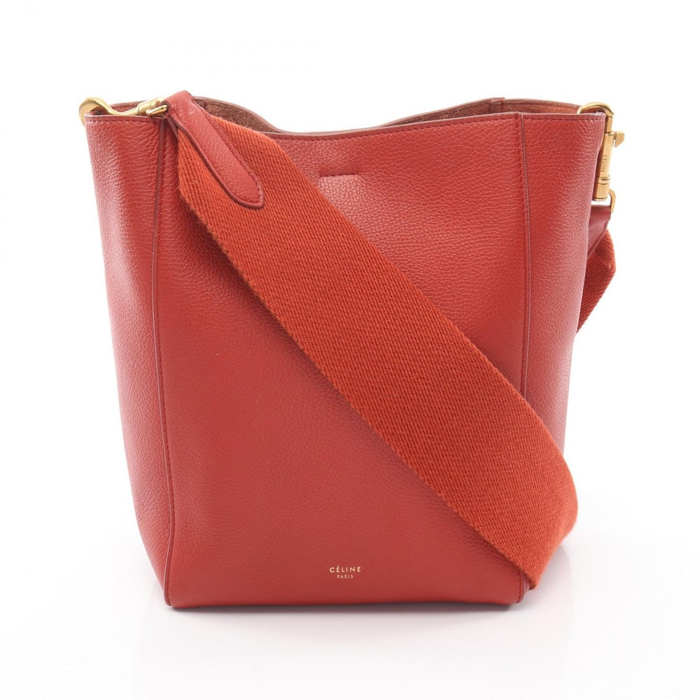 Celine Sangle Bucket Small Red: Authenticated genuine Celine Sangle Bucket Small shoulder bag in orange red leather, model 178303. Approx. H24.5 x W26 top/18 base x D12 cm with 86 cm strap and 37 cm max drop.