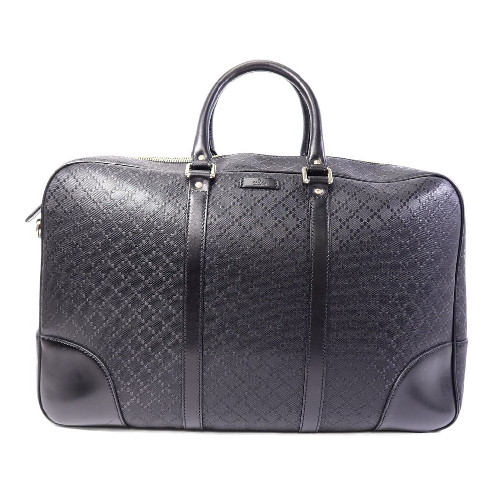 Gucci Duffle Hand Bag Black: Duffle hand bag in black calfskin with gold-tone hardware. Includes storage bags. Size 47 x 27 x 14 cm.