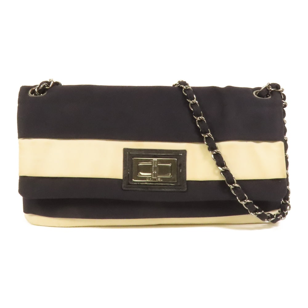 Chanel Chain Shoulder Bag Black White: Authenticated genuine Chanel CC chain shoulder bag in black and white canvas with silver-tone hardware. Includes storage bags and hologram sticker. Product no. 12579607. Approx. W29 x H16 x D2 cm.