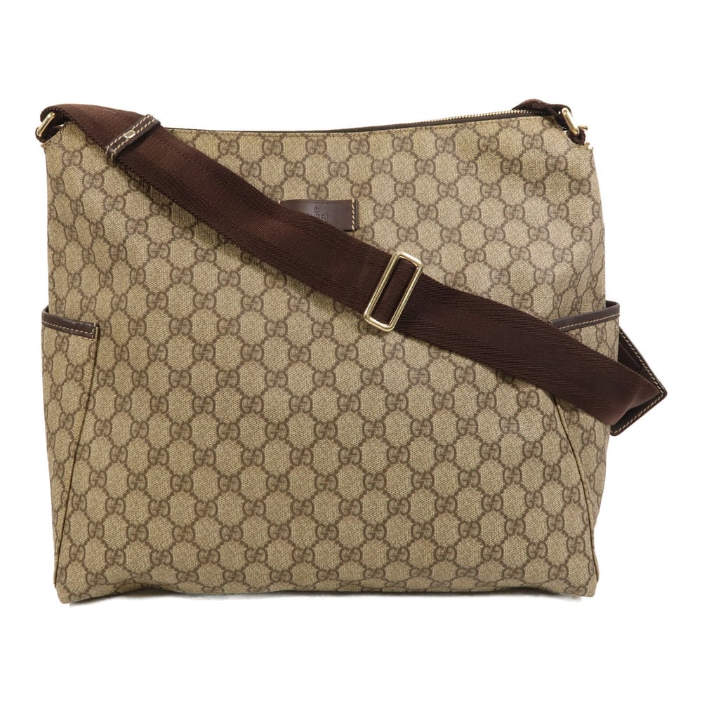 Gucci Coated Canvas Shoulder Bag: Authentic and authenticated Gucci shoulder bag in brown PVC coated canvas. Product no. 212792. Approx. 35W x 33H x 18.5D cm with 66-106 cm shoulder strap. Includes storage bags.