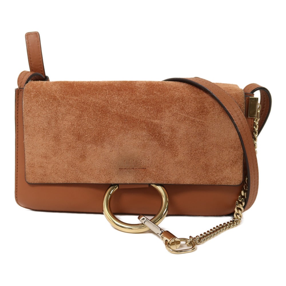 Chloe Suede Shoulder Brown: Chloe Shoulder Bag. Color: Brown / Brown. Material: Suede, Calfskin. Size: 24 X 14.5 X 4 Cm. Shoulder: 109-121 Cm. Includes: Guarantee.
