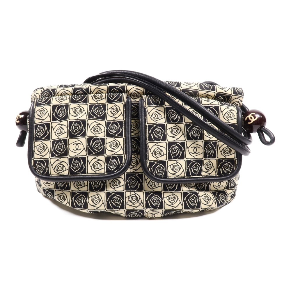 Chanel Vintage Canvas Shoulder Bag: Authenticated genuine Chanel vintage shoulder bag in black beige canvas with silver-tone hardware. Includes hologram sticker. Product no. 8890628. Approx. W40.5 x H23.5 x D10 cm with 56 cm handle.