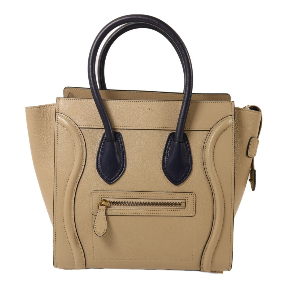 Celine Micro Luggage Beige Navy: Authenticated genuine Celine Micro Luggage tote bag in beige navy calfskin leather with gold-tone hardware. Includes storage bags. Product no. F-CT-0154. Approx. W26-38 x H25 x D11 cm.